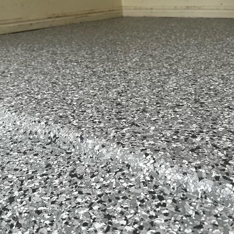 Grey flake floor finish in the existing project gallery