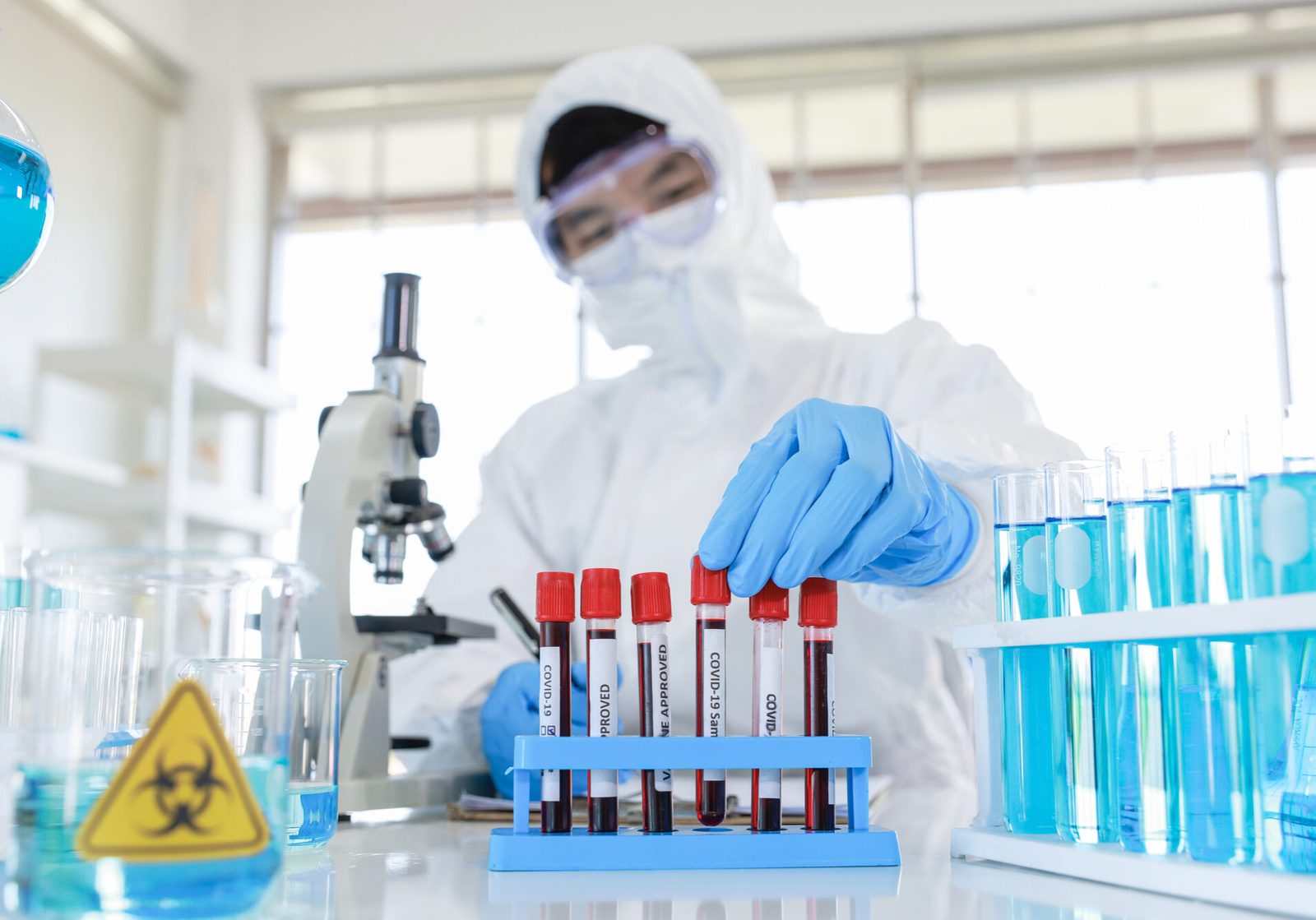 a man holding a test tube