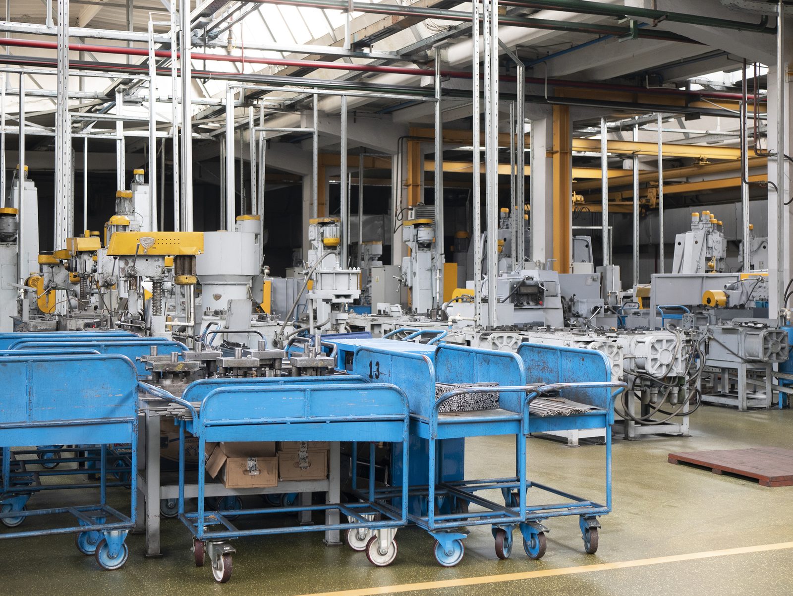 Blue wagons with metal workpieces