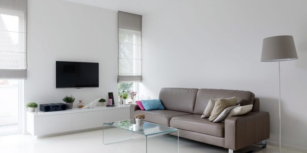White living room with taupe sofa